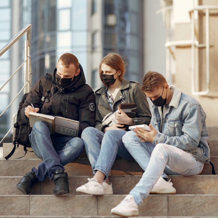 Young people sitting on some steps